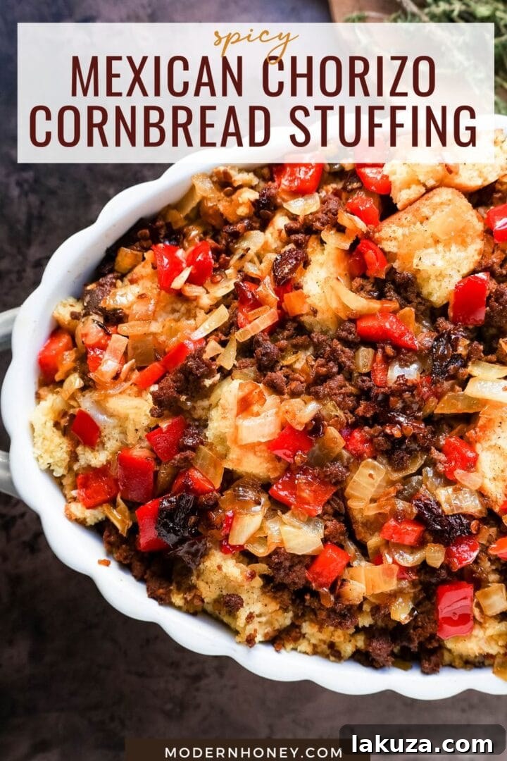 A large casserole dish filled with baked Mexican Chorizo Cornbread Stuffing, ready to be served at a festive dinner.