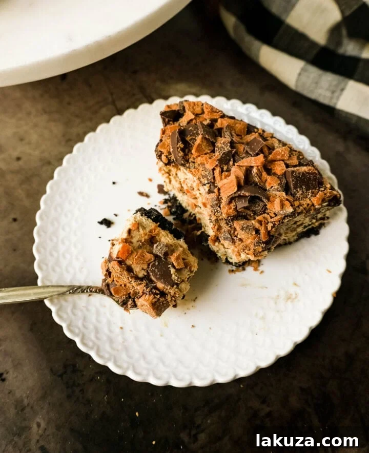 Decadent Butterfinger Pie 4 No-Bake Chocolate Peanut Butter Butterfinger Pie with a chocolate OREO crust, creamy peanut butter filling with Butterfinger candy bars, chocolate ganache, and topped with fresh whipped cream and Butterfinger. The best creamy Butterfinger pie recipe!