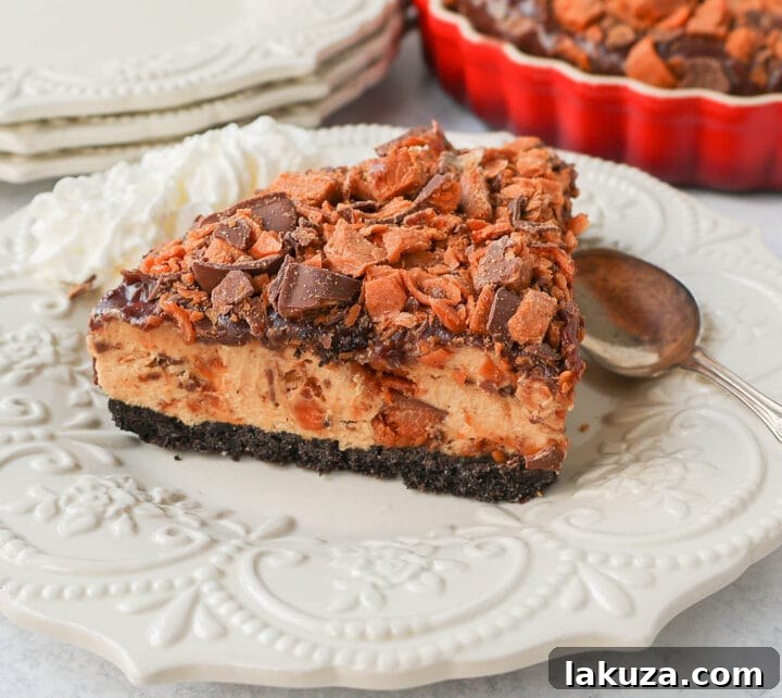Decadent Butterfinger Pie 5 No-Bake Chocolate Peanut Butter Butterfinger Pie with a chocolate OREO crust, creamy peanut butter filling with Butterfinger candy bars, chocolate ganache, and topped with fresh whipped cream and Butterfinger. The best creamy Butterfinger pie recipe!