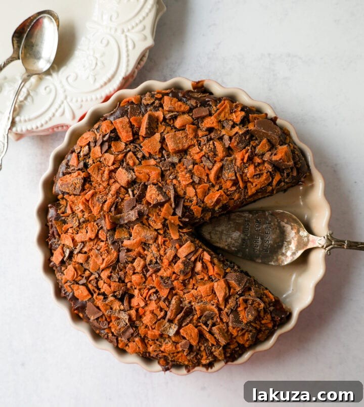 Decadent Butterfinger Pie 6 No-Bake Chocolate Peanut Butter Butterfinger Pie with a chocolate OREO crust, creamy peanut butter filling with Butterfinger candy bars, chocolate ganache, and topped with fresh whipped cream and Butterfinger. The best creamy Butterfinger pie recipe!