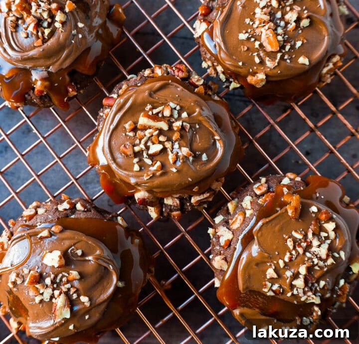 Chocolate Caramel Pecan Turtle Cookies, made with a chewy chocolate cookie base, rolled in pecans, and generously topped with caramel and melted chocolate.