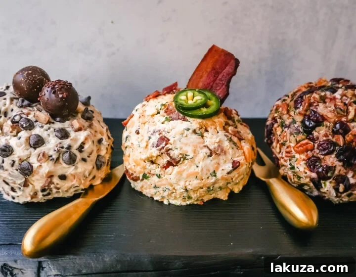 A vibrant platter featuring a variety of cheese balls, including Cheddar Bacon, Cranberry Pecan, and a sweet Chocolate Cream Cheese Ball, surrounded by crackers and fresh garnishes.