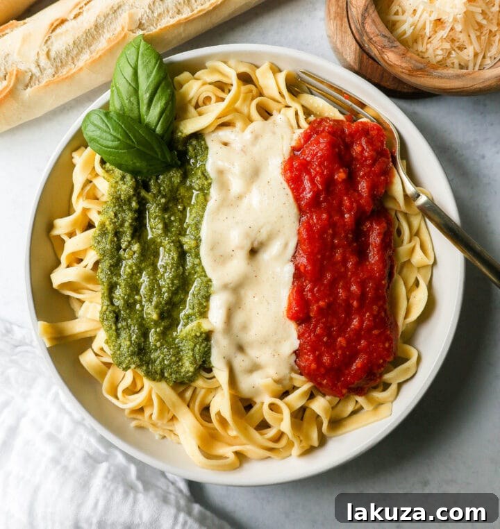Close-up of the Christmas Pasta, showcasing the blend of Alfredo, Marinara, and Pesto sauces.