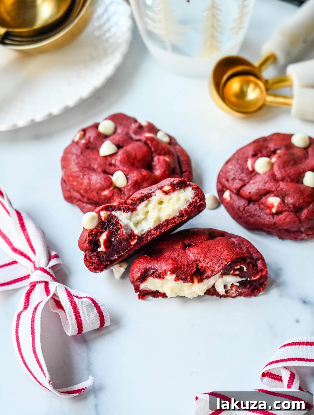 80 Irresistible Christmas Cookie Recipes 12 Cheesecake Stuffed Red Velvet Cookies with white chocolate chips and a creamy cheesecake center. A vibrant and delicious Christmas cookie.