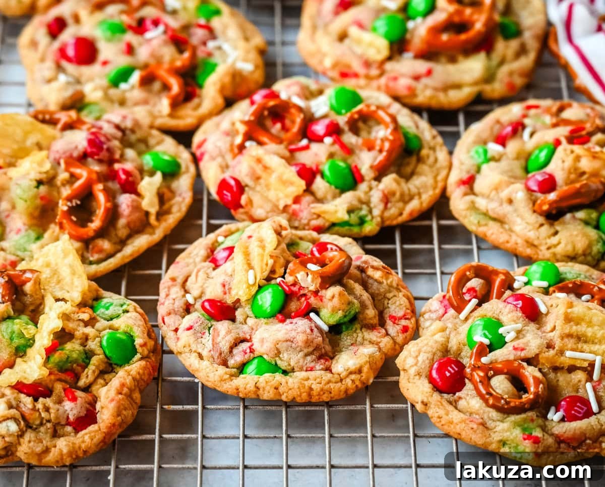 80 Irresistible Christmas Cookie Recipes 21 Christmas Kitchen Sink Cookies: packed with holiday M&M's, pretzels, potato chips, sprinkles, and chocolate chips for sweet, salty, and festive flavors in every bite. Perfect for holiday baking and gifting!