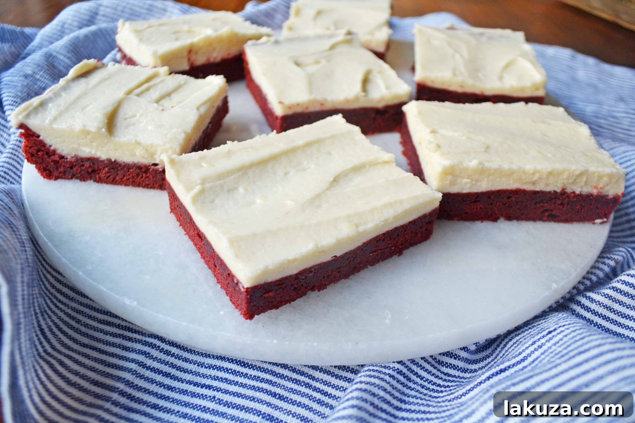 80 Irresistible Christmas Cookie Recipes 94 Red Velvet Sugar Cookie Bars by Modern Honey: red velvet sugar cookies topped with cream cheese frosting.