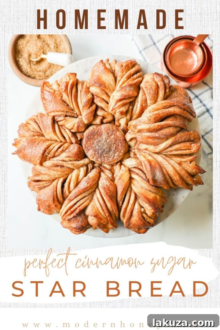 Cinnamon Sugar Star Bread, beautifully baked and dusted with powdered sugar, ready to be pulled apart and enjoyed.