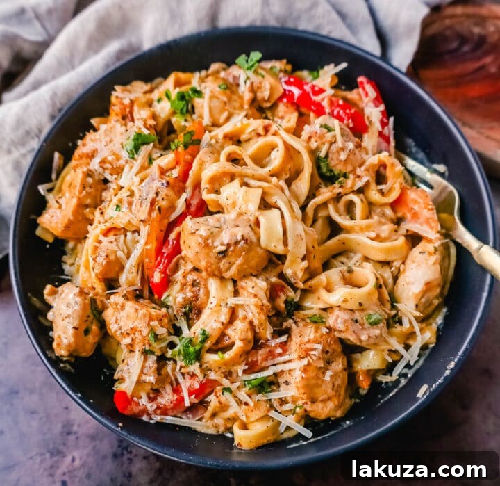 Rich and Spicy Cajun Chicken Pasta 2 Creamy Cajun Chicken Pasta - a hearty, spicy, and delicious chicken alfredo dish with tender chicken pieces and a rich sauce.