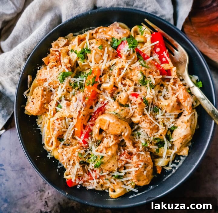 Rich and Spicy Cajun Chicken Pasta 3 Close-up of Creamy Cajun Chicken Pasta in a bowl, showcasing the rich sauce, tender chicken, and vibrant seasonings.