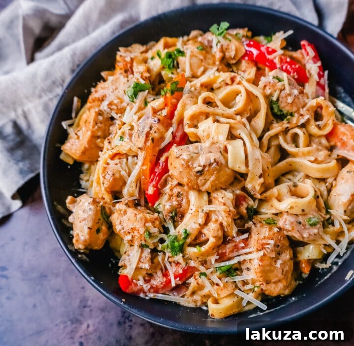 Rich and Spicy Cajun Chicken Pasta 4 Delicious Creamy Cajun Chicken Pasta topped with fresh parsley and grated Parmesan cheese.
