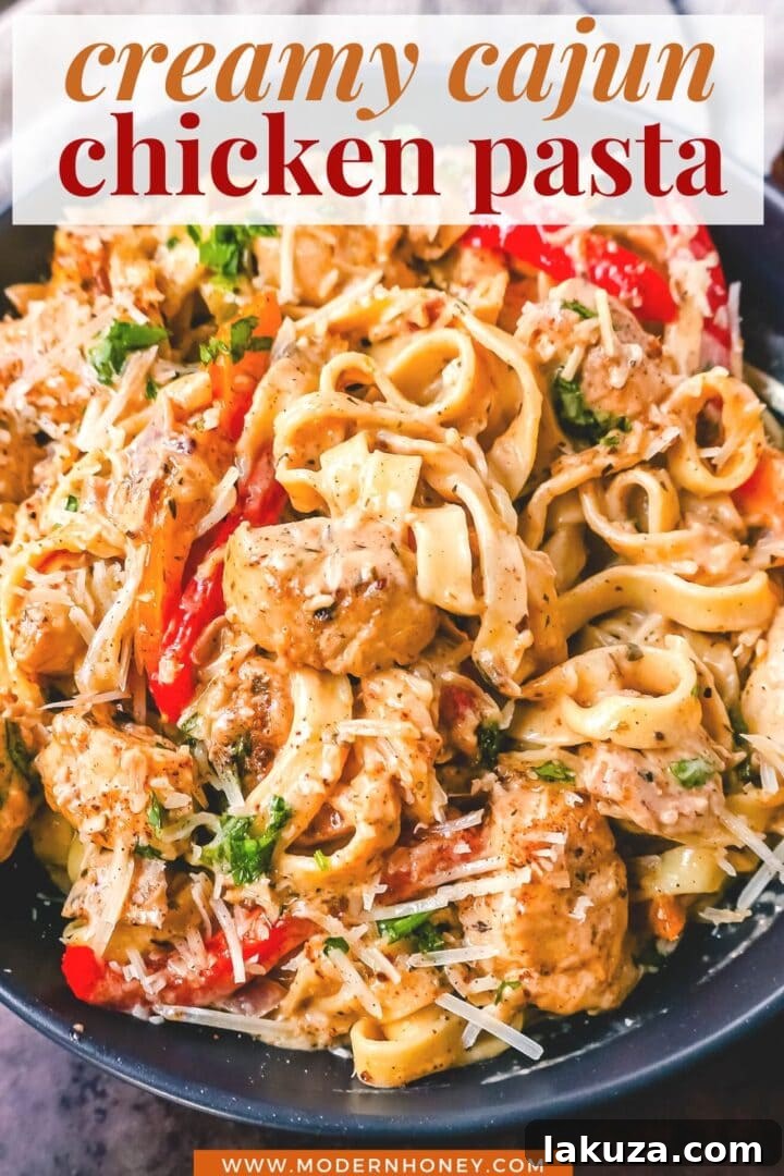 Rich and Spicy Cajun Chicken Pasta 6 Creamy Cajun Chicken Pasta served in a large bowl, garnished with fresh herbs and cheese.