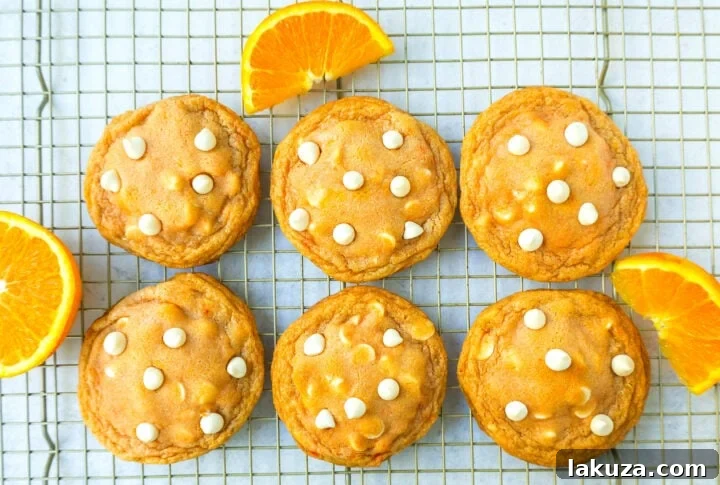 A stack of perfectly baked Soft and Chewy Orange Creamsicle Cookies, ready to be enjoyed.