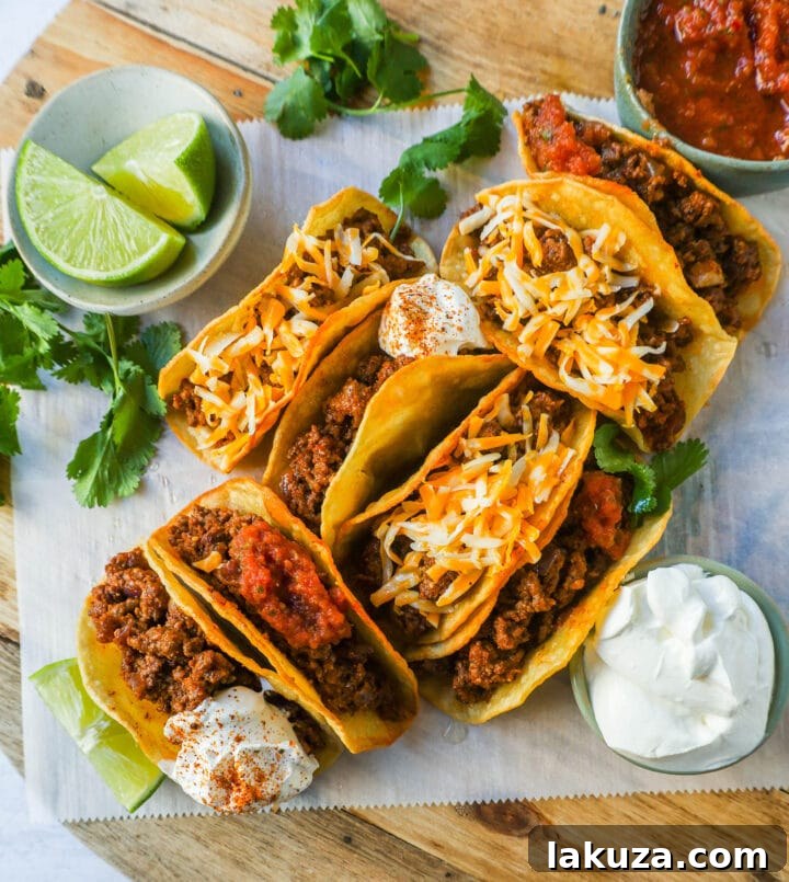 Savory Ground Beef Tacos 4 A vibrant spread of taco toppings laid out for a build-your-own taco bar.