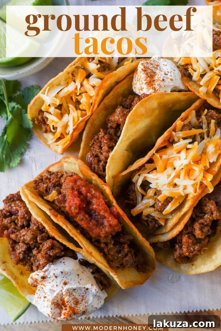 Savory Ground Beef Tacos 8 A vibrant and inviting image of multiple ground beef tacos garnished with fresh ingredients.
