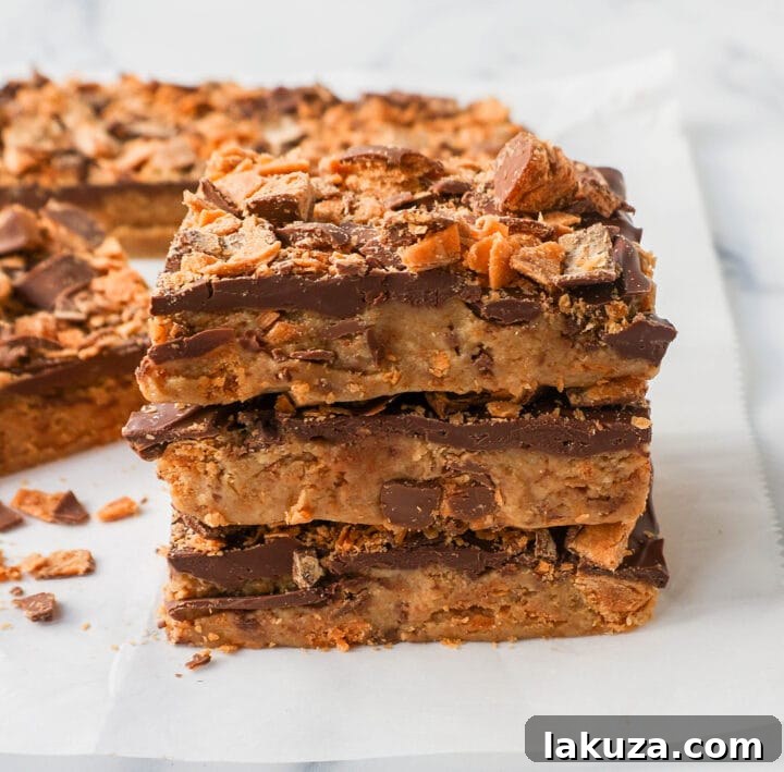 Ultimate Butterfinger Crunch Bars 2 Delicious no-bake Butterfinger bars with a creamy peanut butter chocolate blend and crunchy texture, perfect for any occasion.