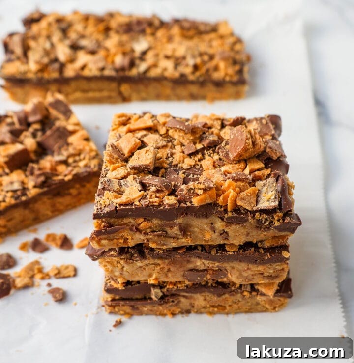 Ultimate Butterfinger Crunch Bars 7 A full platter of delicious No-Bake Butterfinger Bars, showcasing the beautiful toppings and ready to be served at a party or gathering.