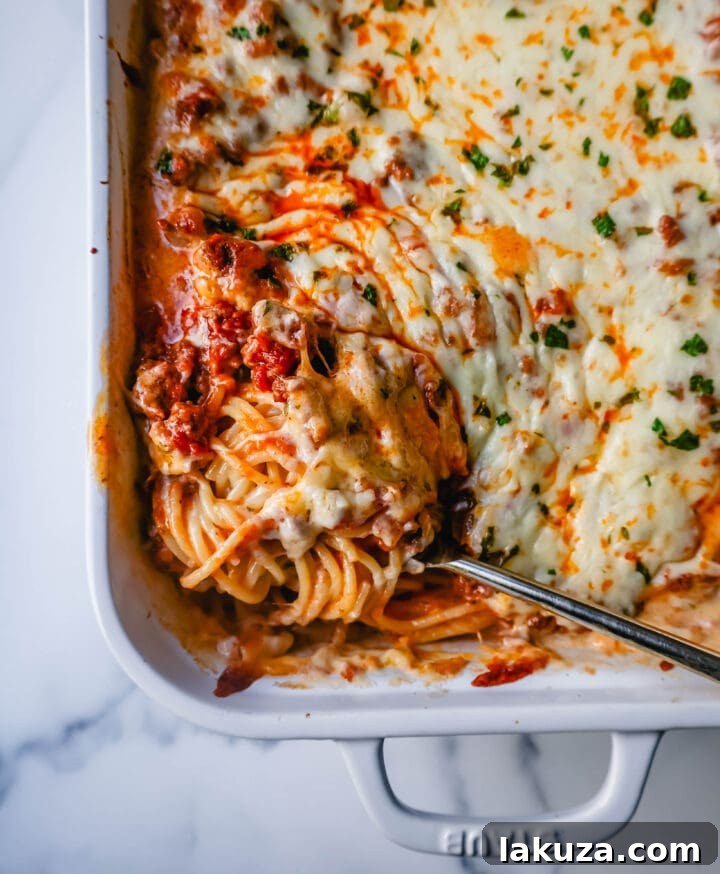 TikTok's Million-Dollar Baked Spaghetti Sensation 5 Layering the Million Dollar Spaghetti in a baking dish
