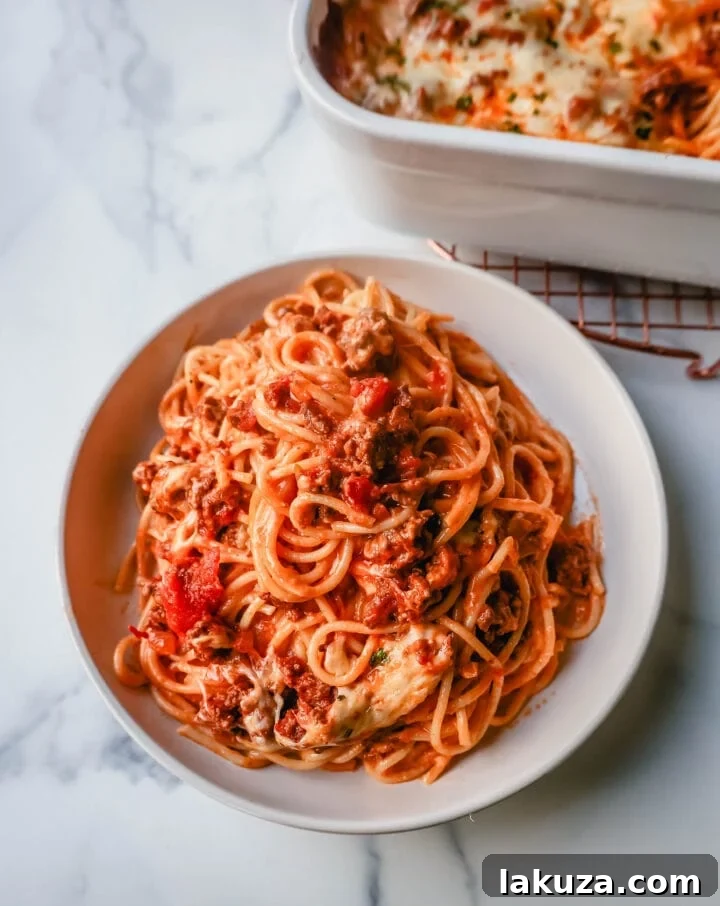 TikTok's Million-Dollar Baked Spaghetti Sensation 7 Delicious TikTok Million Dollar Baked Spaghetti served with fresh parsley
