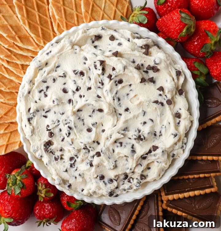 Cannoli Cream Delight 2 Creamy Cannoli Dip with mini chocolate chips served with waffle cone pieces, a perfect easy dessert recipe.
