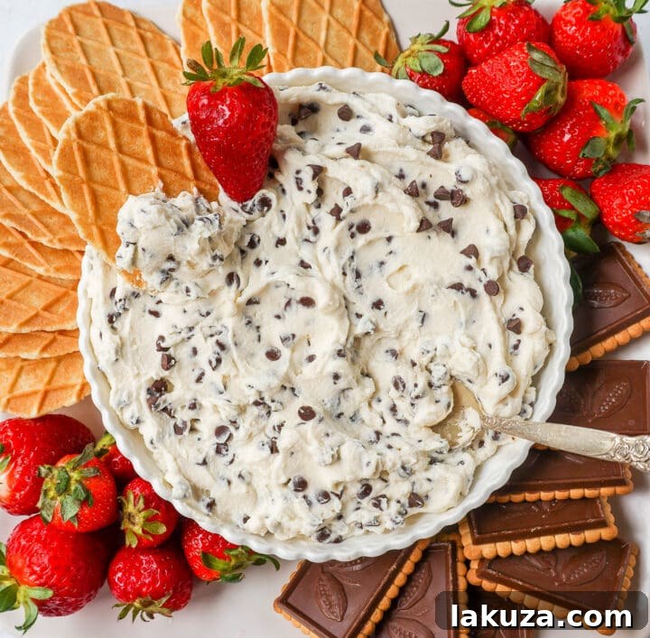 Cannoli Cream Delight 5 The finished homemade cannoli dip, garnished with extra mini chocolate chips and a few pizzelle cookies for dipping.