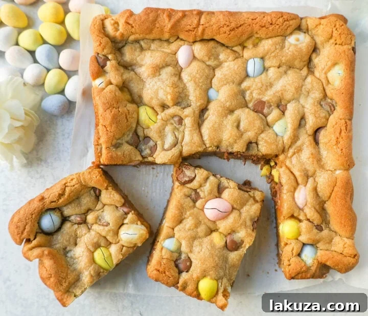 Chewy Easter Cadbury Mini Egg Blondies bars loaded with milk chocolate chips and crunchy mini Cadbury eggs.