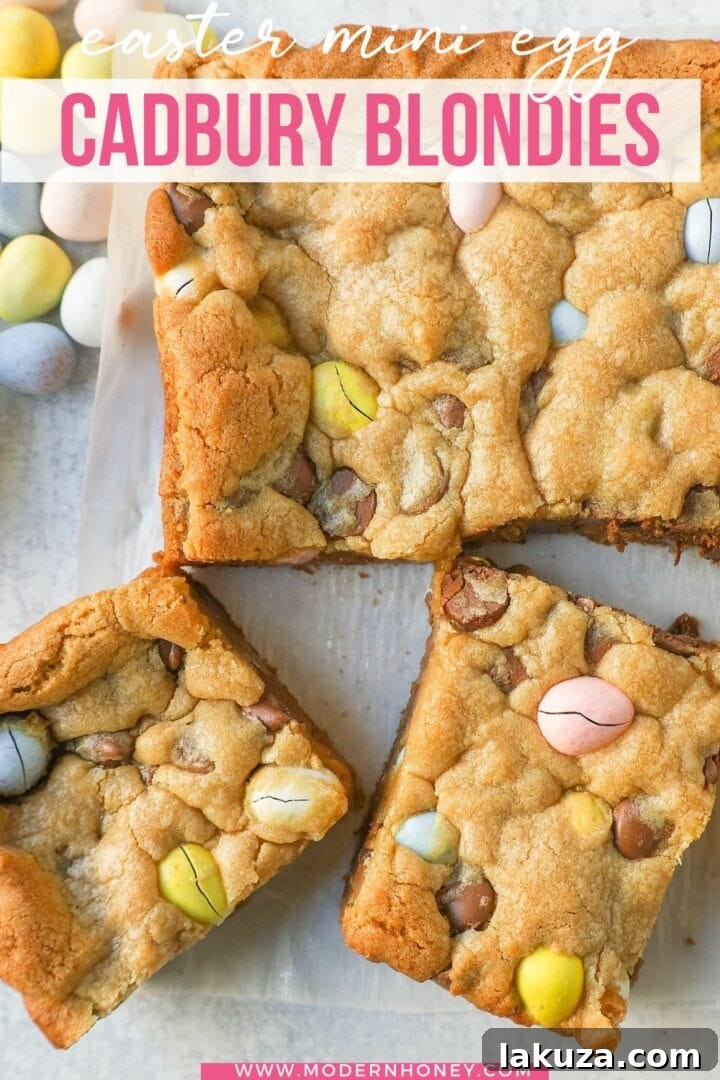 A stack of Cadbury Mini Egg Blondies with a fork, ready to be enjoyed.