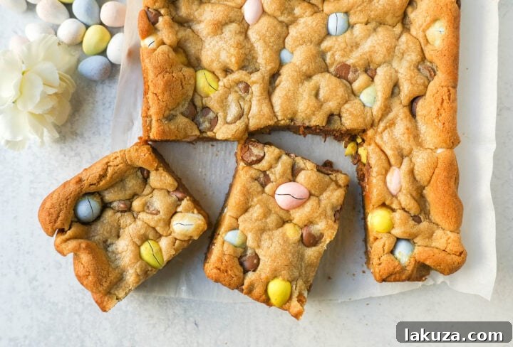 Close-up of blondie dough with Cadbury Mini Eggs folded in, ready for baking.