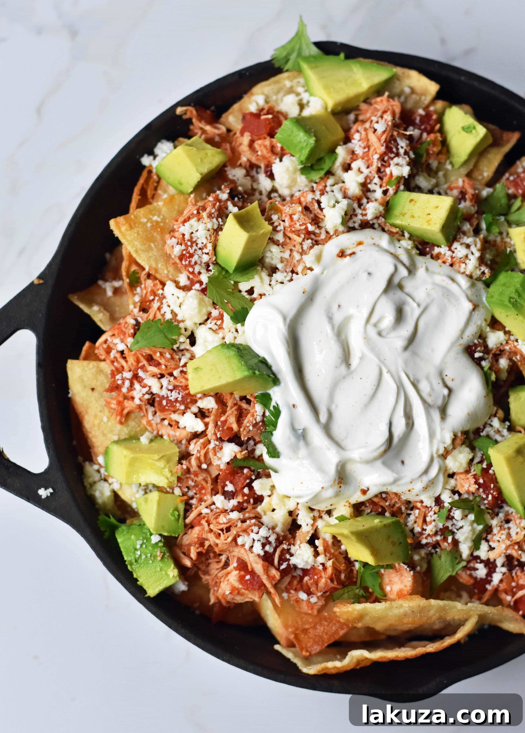 Effortless Chicken Chilaquiles 2 Flavorful Easy Chicken Chilaquiles with Chipotle Chicken, Mexican Cheese, and Fresh Avocado