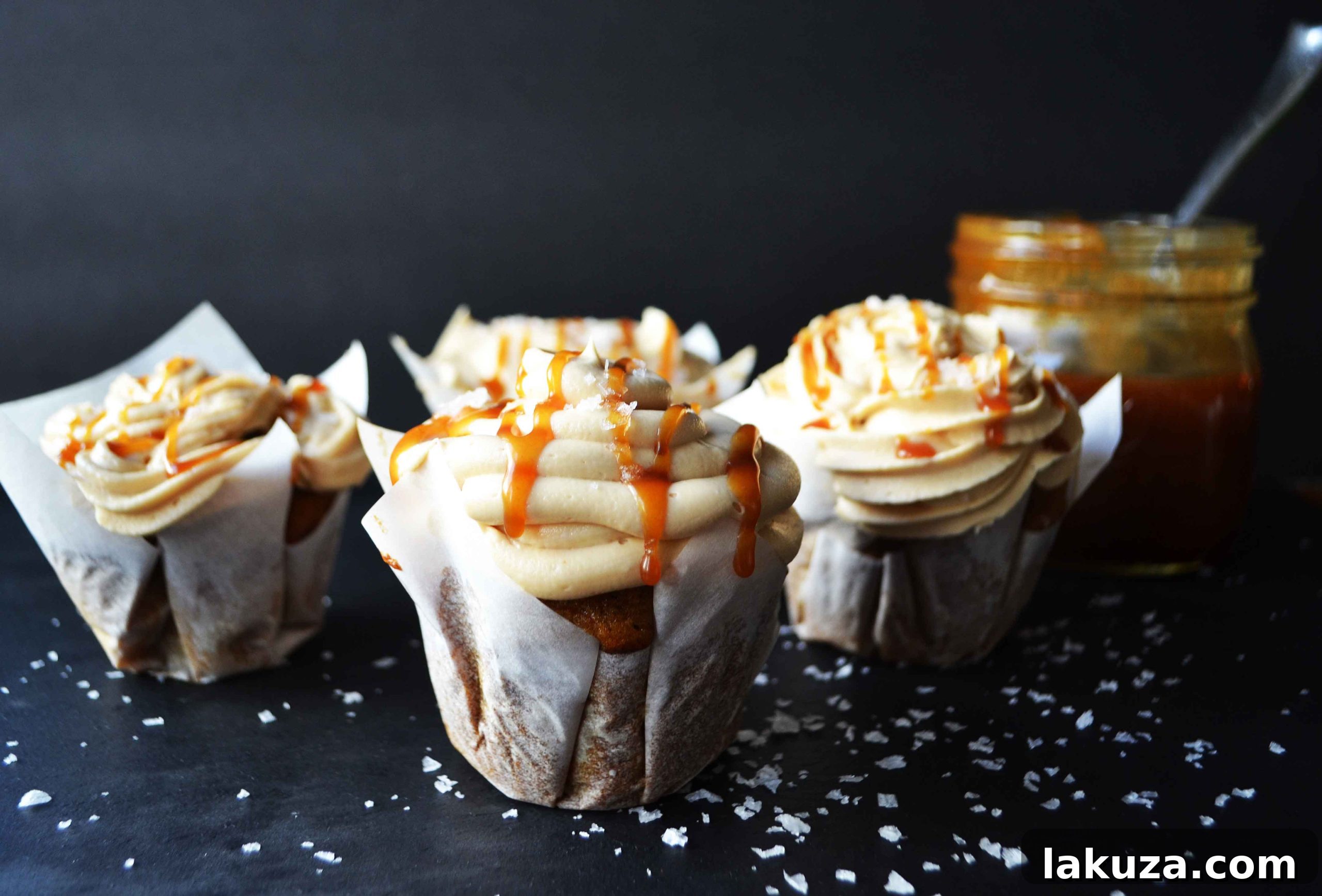 Delicious Pumpkin Cupcakes with Luscious Salted Caramel Frosting, perfect for Fall baking and gatherings.