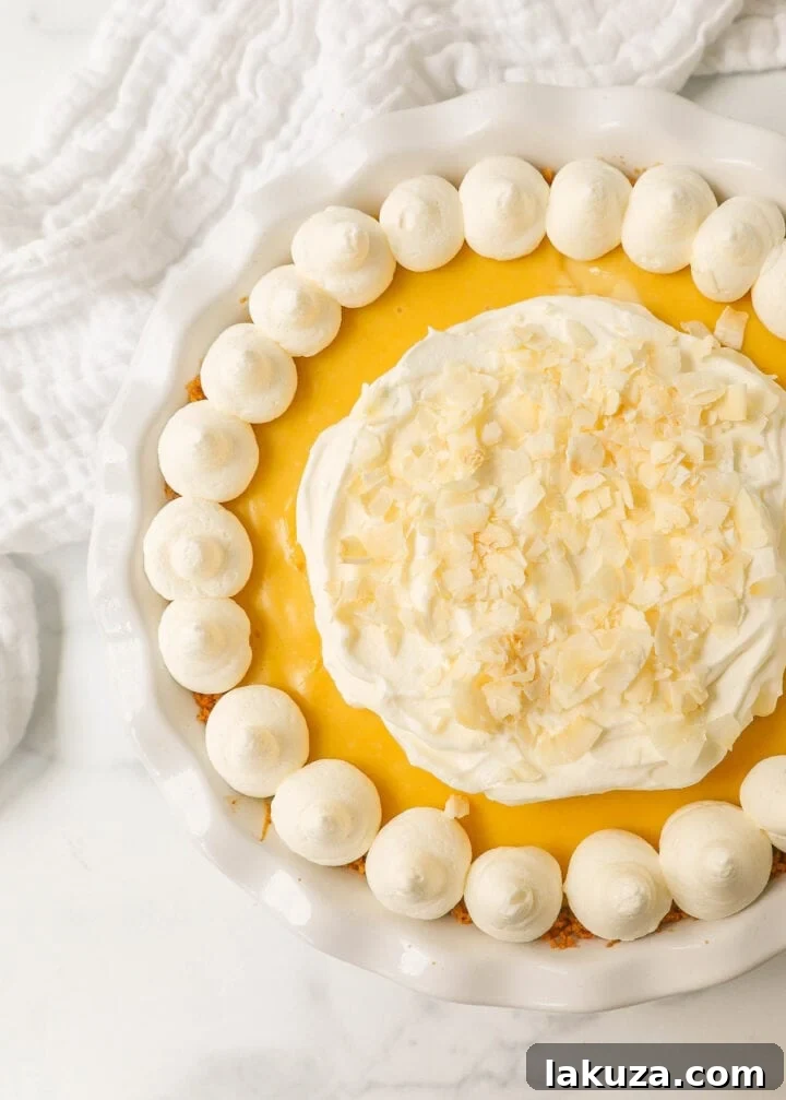 Tropical Passion Tart 3 The whole creamy Lilikoi Pie, showcasing its smooth texture and light golden crust, ready for serving.