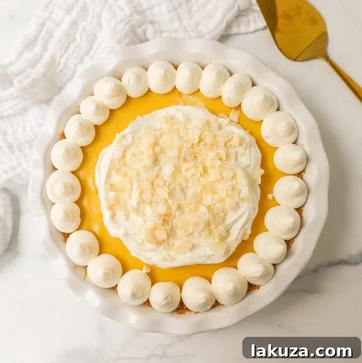 Tropical Passion Tart 5 A beautifully sliced passion fruit pie, ready to be served, showcasing its vibrant filling and fluffy whipped cream.