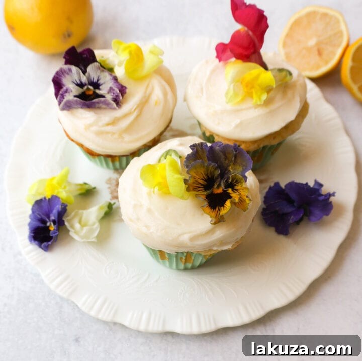 Bright Lemon Cupcake Bliss 6 An array of cheerful lemon cupcakes, some frosted with a swirl, some garnished with lemon slices, highlighting their vibrant appeal.