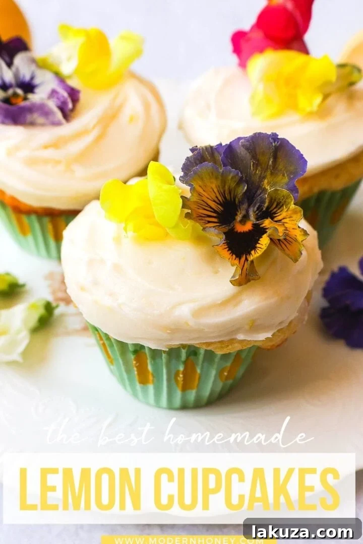 Bright Lemon Cupcake Bliss 7 An overhead view of numerous freshly baked and frosted lemon cupcakes, beautifully arranged and ready for serving.