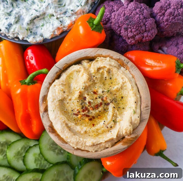 Veggie Platter with Dips. How to make a beautiful Crudite Platter with vegetables and dips. I am sharing my favorite veggie dip recipes, what vegetables to put on a veggie tray, and how to arrange one. It is so easy to make a stunning vegetable platter!