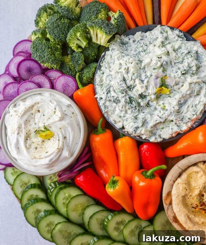 Veggie Platter with Dips. How to make a beautiful Crudite Platter with vegetables and dips. I am sharing my favorite veggie dip recipes, what vegetables to put on a veggie tray, and how to arrange one. It is so easy to make a stunning vegetable platter!