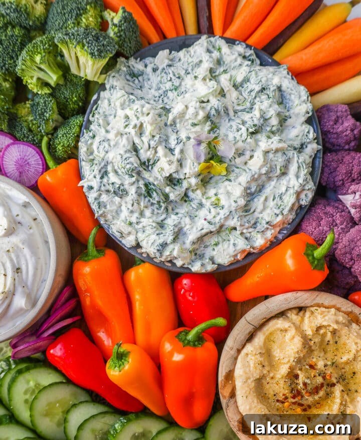 How to make a beautiful Crudite Platter with vegetables and dips. I am sharing my favorite veggie dip recipes, what vegetables to put on a veggie tray, and how to arrange one. It is so easy to make a stunning vegetable platter!