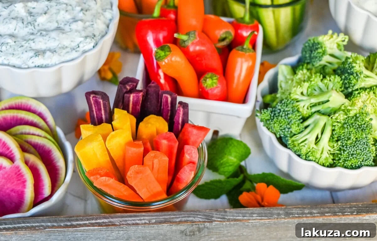 Rainbow heirloom carrots and mini sweet peppers. How to create a beautiful crudite platter also known as a vegetable platter, veggie tray or veggies and dips. Ideas on what vegetables to use and what dips to pair with vegetables.