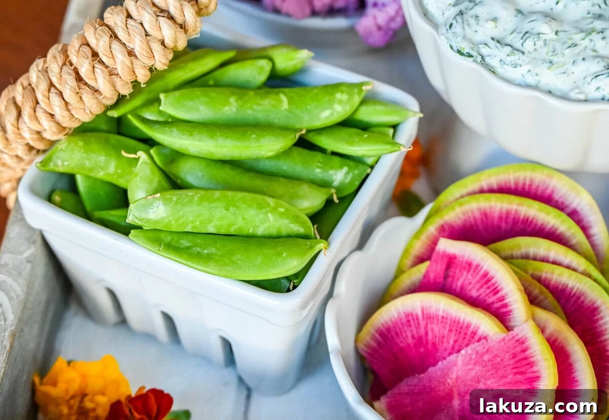 Snap peas on vegetable board also crudite platter
