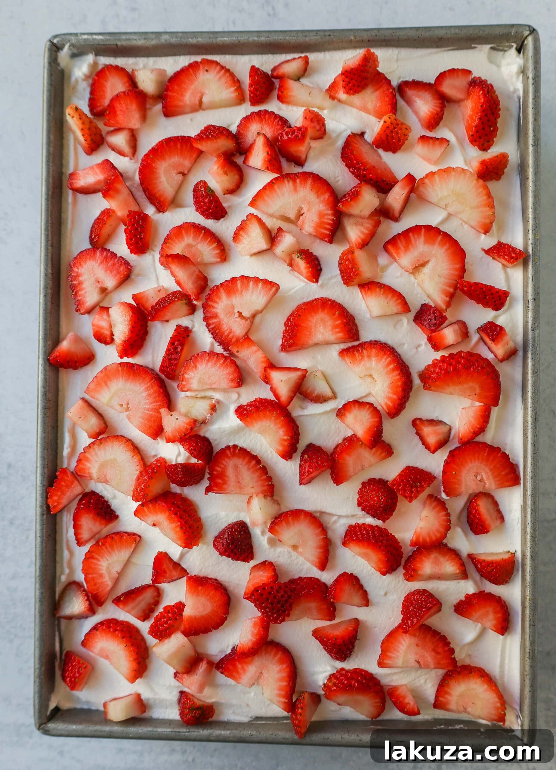 Strawberry Crunch Delight Cake 4 This Strawberry Cream Crunch Cake is a strawberry cake soaked with sweetened condensed milk after baking and topped with fresh sweet whipped cream, fresh strawberries, and crushed golden Oreos for crunch. This strawberry poke cake has it all!