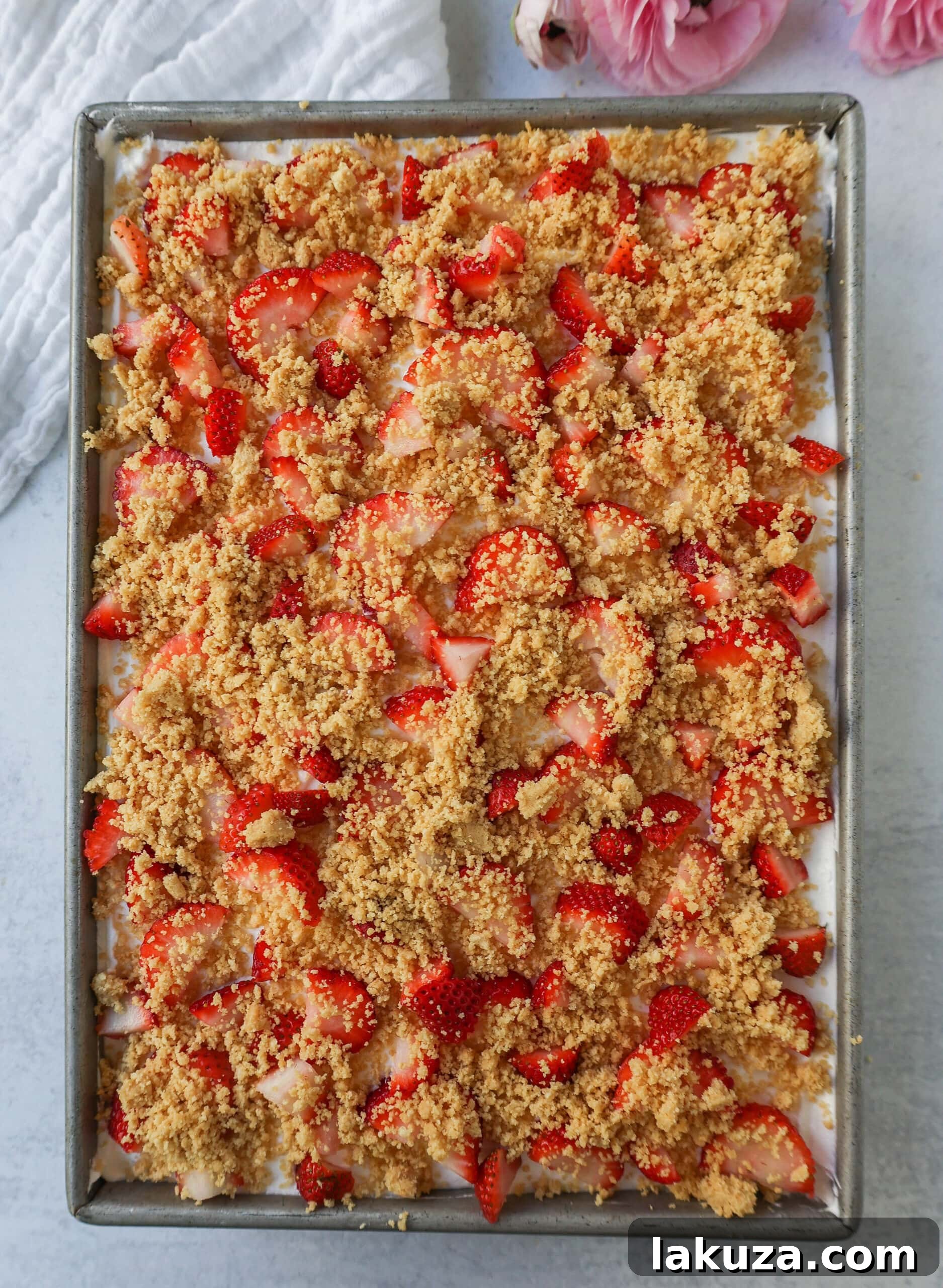 Strawberry Crunch Delight Cake 5 This Strawberry Cream Crunch Cake is a strawberry cake soaked with sweetened condensed milk after baking and topped with fresh sweet whipped cream, fresh strawberries, and crushed golden Oreos for crunch. This strawberry poke cake has it all!