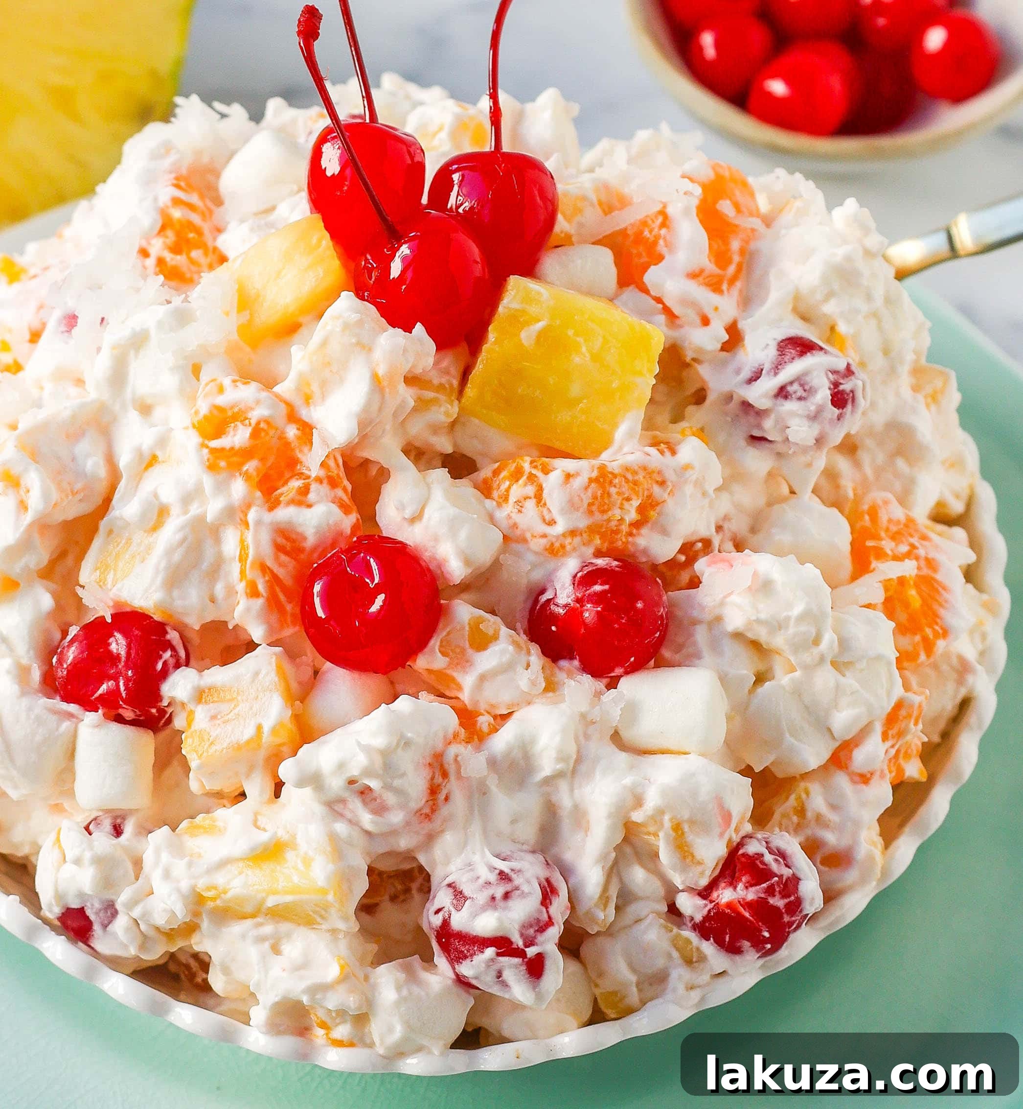 Sweet Ambrosia Cloud 5 Overhead view of Ambrosia Salad, highlighting the fresh, fluffy ingredients. A perfect blend of sweet and tangy for any festive meal or family gathering.