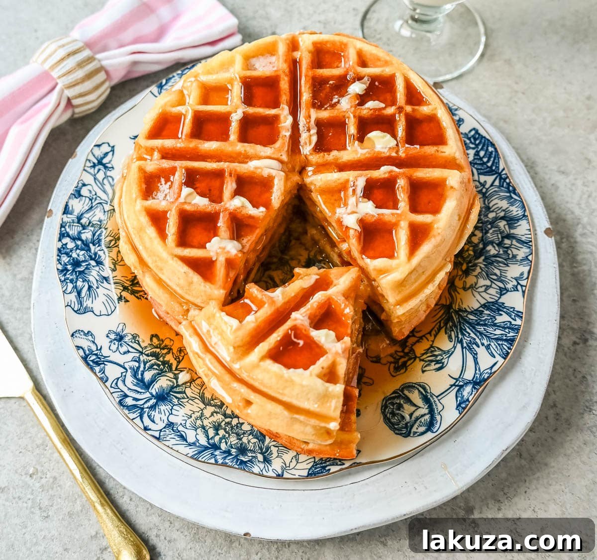 Waffle batter being poured into a hot waffle iron, promising perfect buttermilk waffles.