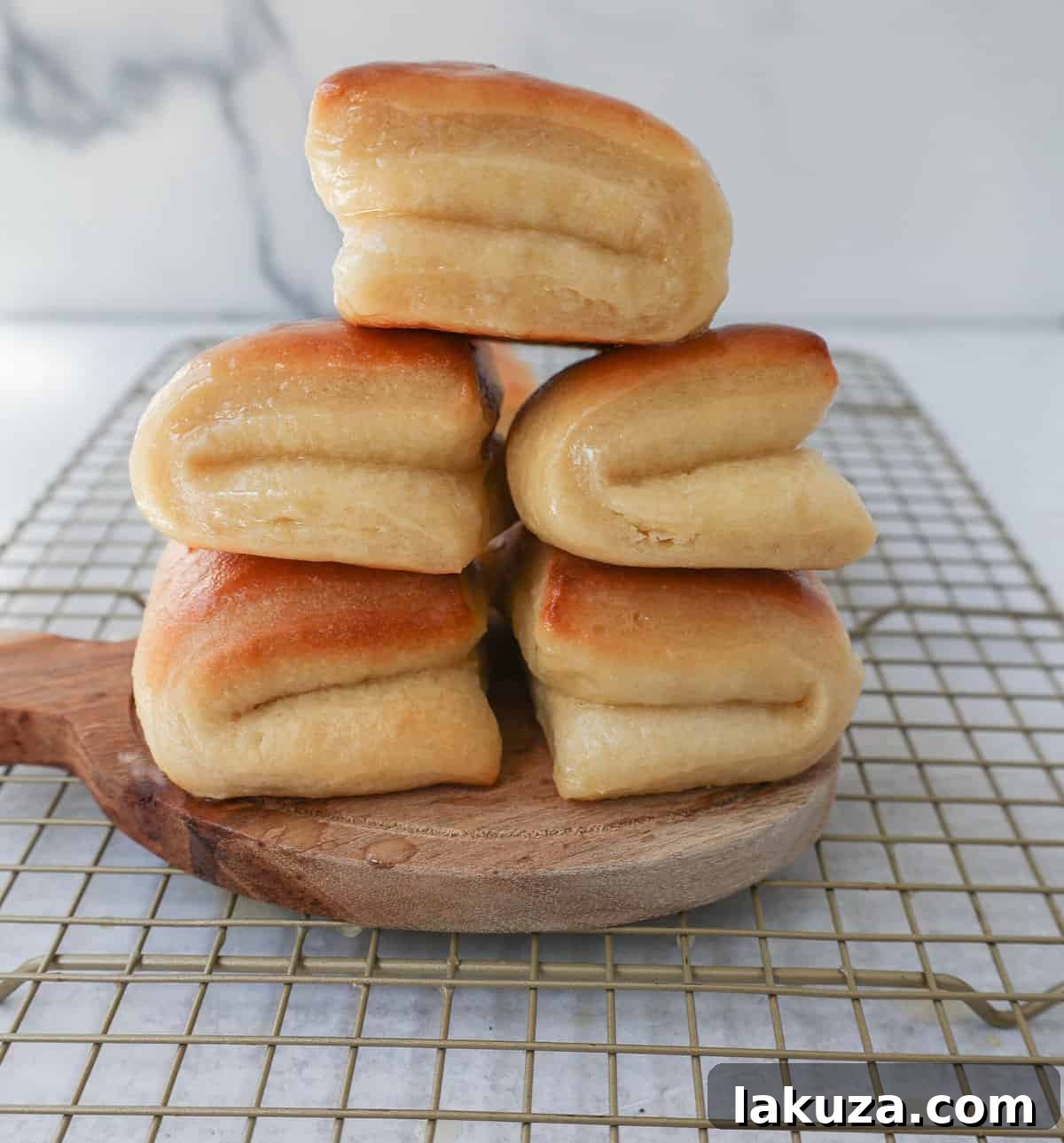 Ultimate Parker House Rolls 4 The Famous Parker House Rolls are light, fluffy, and buttery with a secret ingredient that make them tender and melt in your mouth. This the best parker house roll recipe!