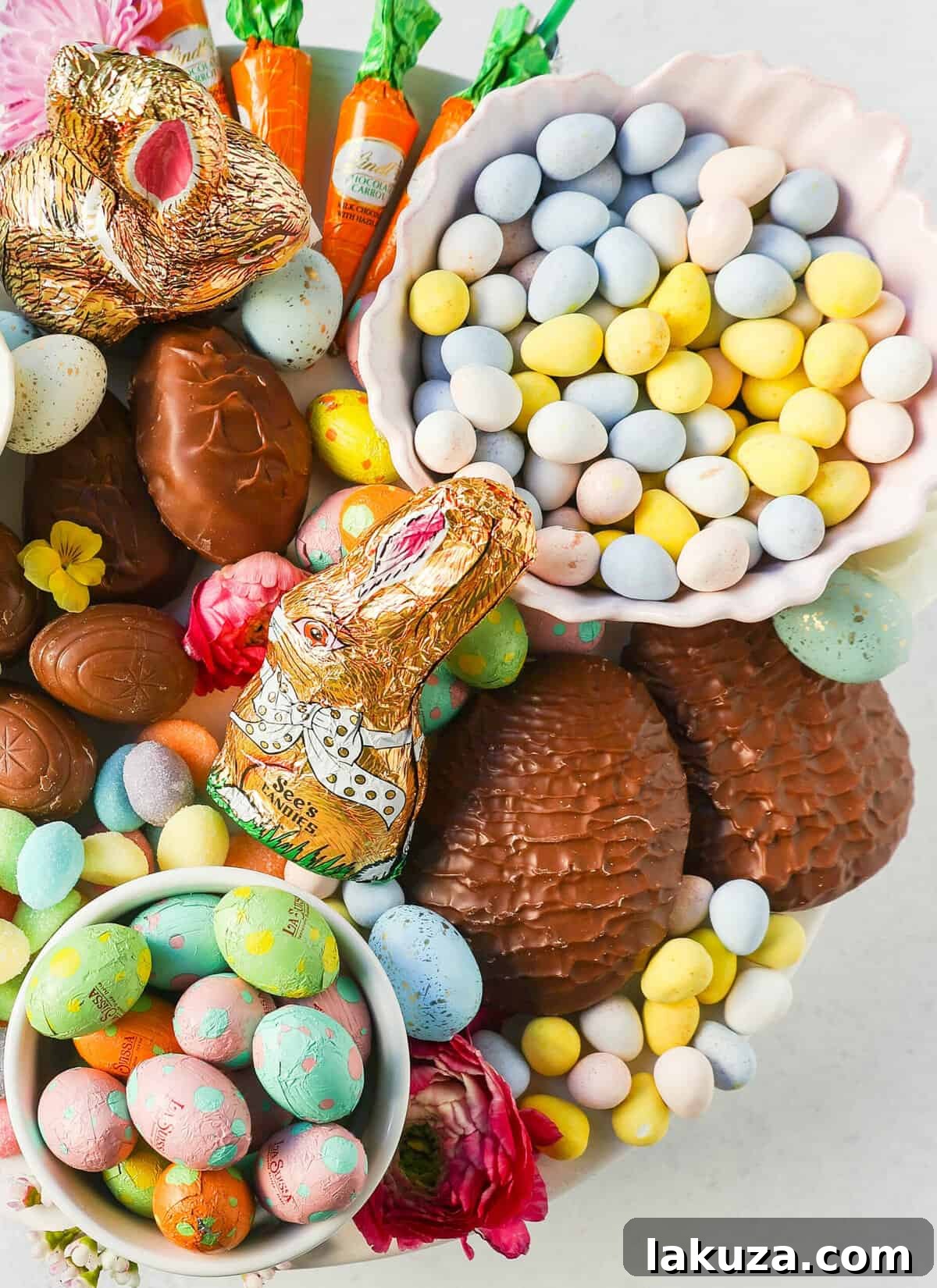 An overhead shot of a vibrant Easter charcuterie board, packed with a wide assortment of candy, ready to be enjoyed.