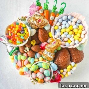 A delightful Easter Candy Charcuterie Board, featuring colorful and sweet Easter candies and decadent chocolates.