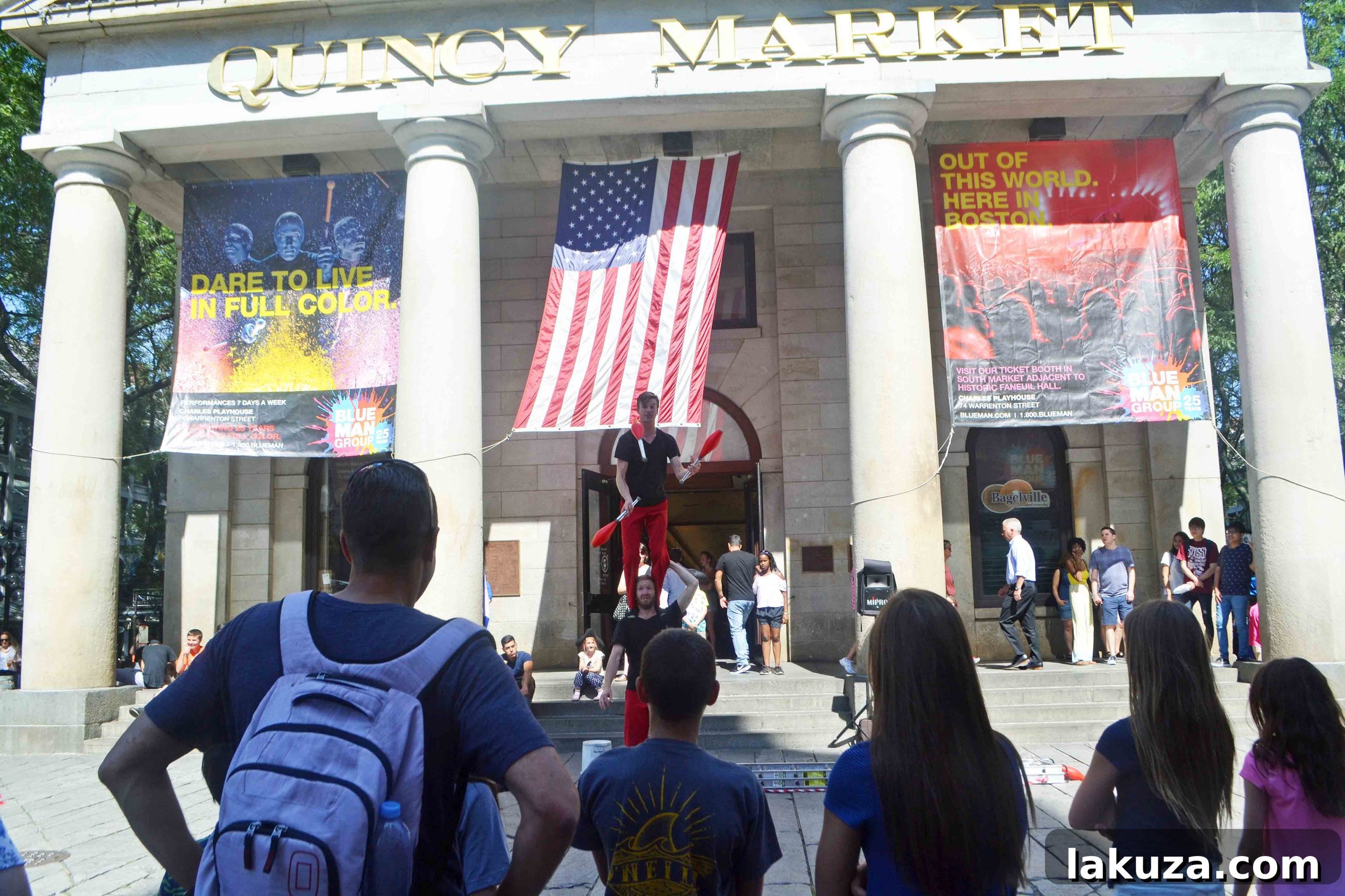 Explore Boston's Flavors and Unforgettable Sights 9 Faneuil Hall Marketplace bustling with visitors and street performers