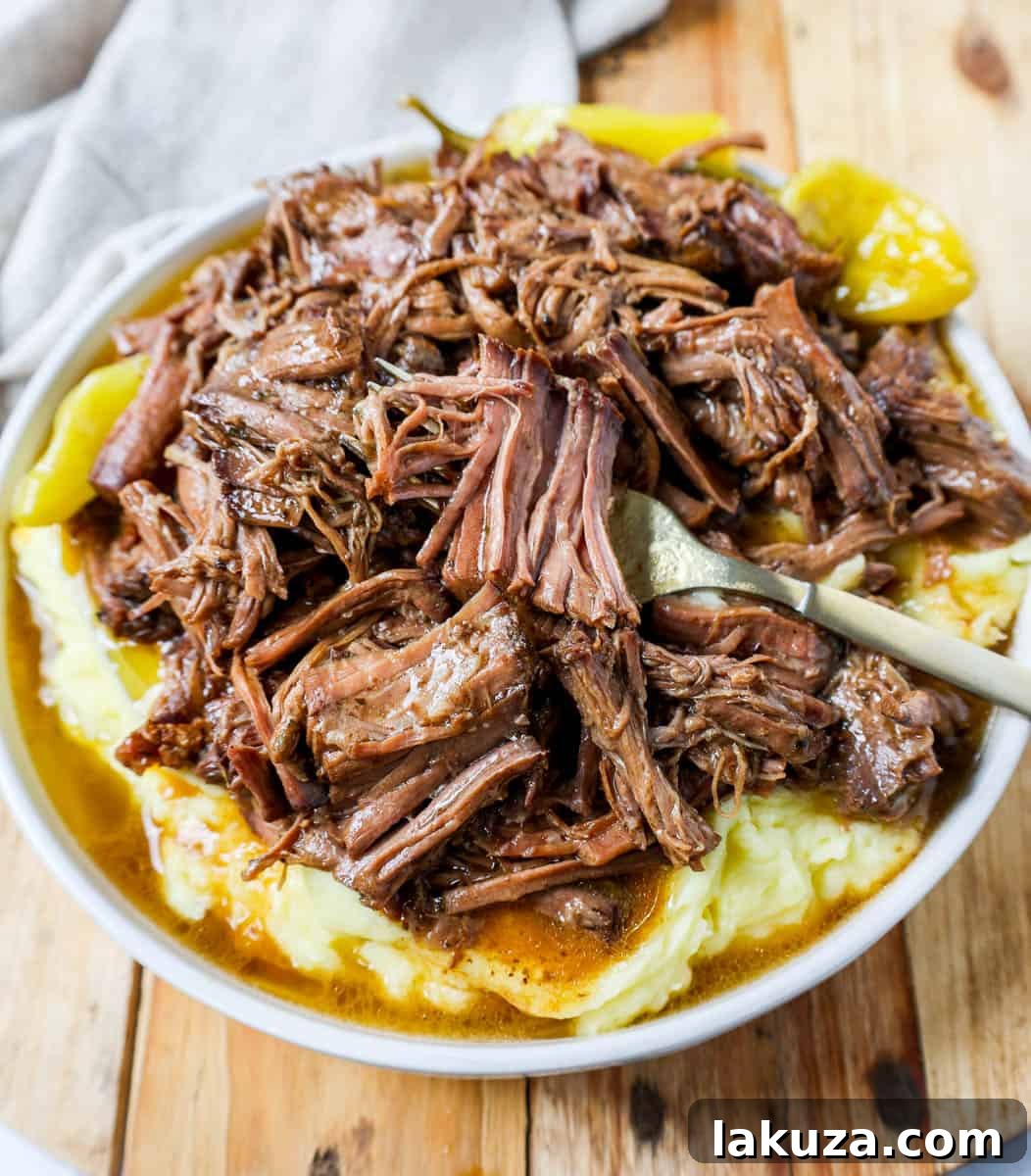 A serving of Mississippi Pot Roast topped with fresh parsley, ready for a meal.