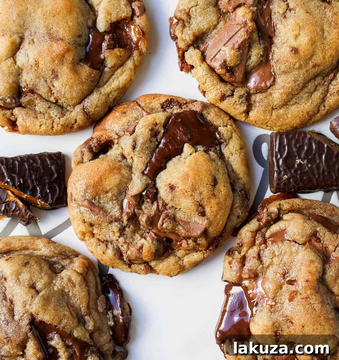 Caramelized Butter Toffee Chip Cookies 2 Irresistible browned butter toffee chocolate chip cookies with melted chocolate and golden toffee bits, showing their perfect soft and chewy texture.