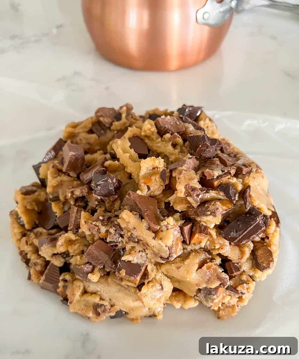 Caramelized Butter Toffee Chip Cookies 12 Browned Butter Toffee Chocolate Chip Cookies dough wrapped tightly in plastic wrap, ready for chilling in the refrigerator.