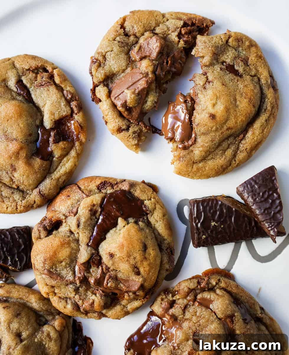 Caramelized Butter Toffee Chip Cookies 13 A delicious plate of browned butter toffee chocolate chip cookies ready to be enjoyed, highlighting their golden hue.